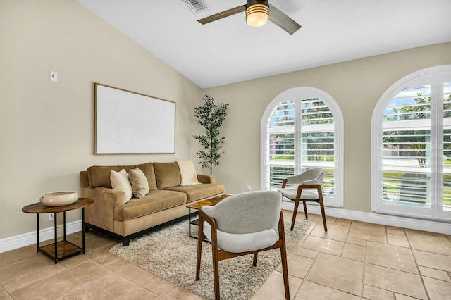 living room featuring vaulted ceiling and ceiling fan