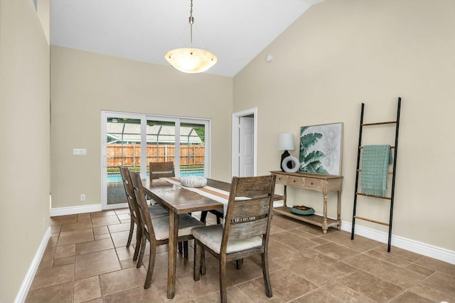 dining space with lofted ceiling