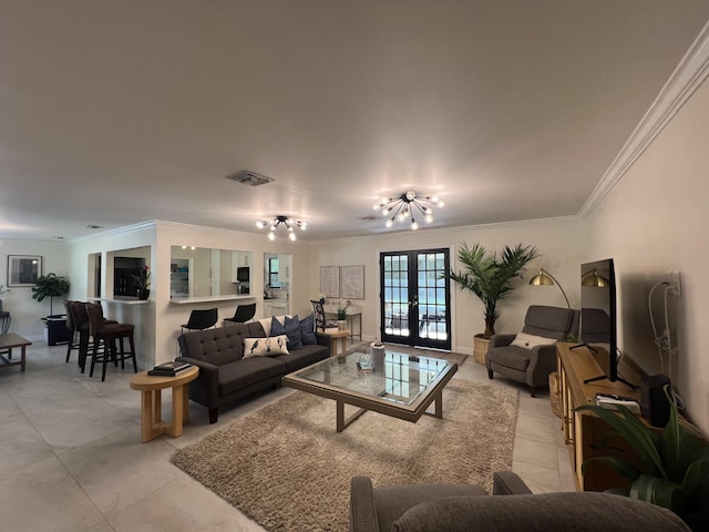 living room with a chandelier, ornamental molding, and french doors