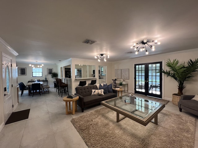 living room with crown molding, french doors, light tile patterned floors, and an inviting chandelier