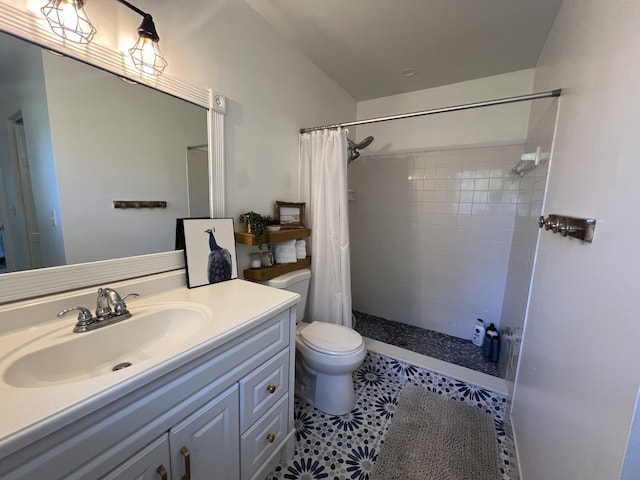 bathroom with a shower with shower curtain, vanity, toilet, and tile patterned flooring