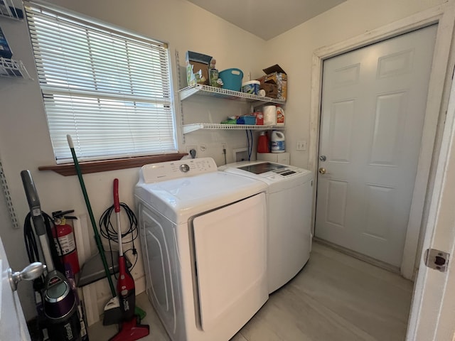 washroom with independent washer and dryer