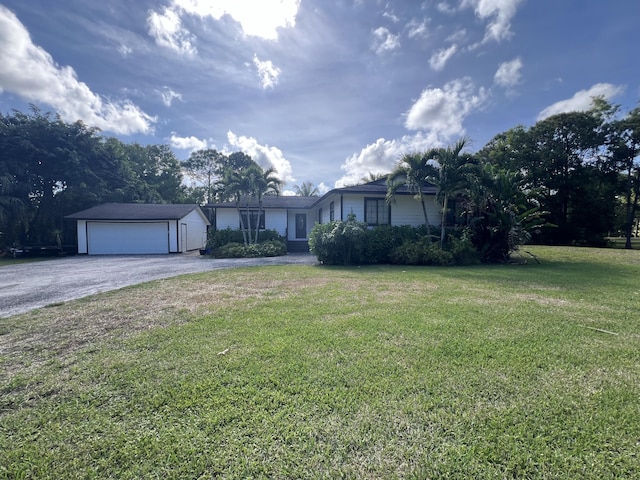 view of front facade featuring a garage and a front yard