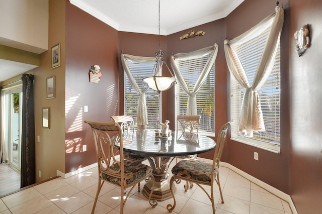 dining space featuring light tile patterned floors and ornamental molding