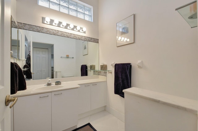 bathroom featuring toilet, vanity, and tile patterned floors