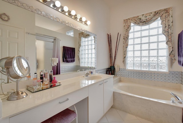 bathroom with plus walk in shower, vanity, tile patterned floors, and a healthy amount of sunlight