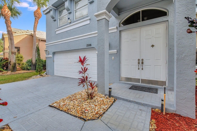 property entrance with a garage