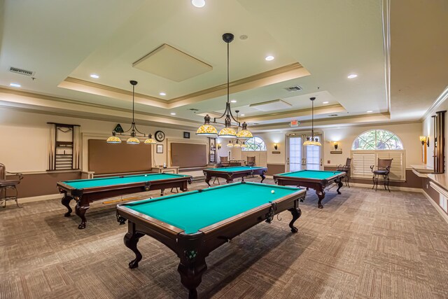 rec room with light carpet, pool table, and a tray ceiling