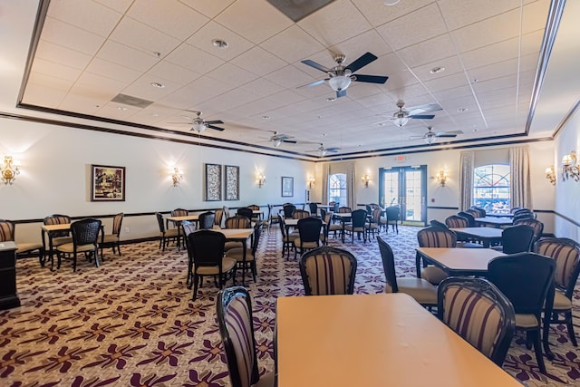 dining room with ornamental molding, carpet flooring, ceiling fan, and french doors