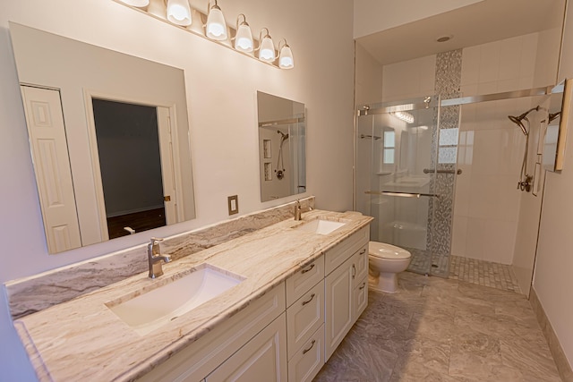 bathroom with vanity, toilet, and walk in shower