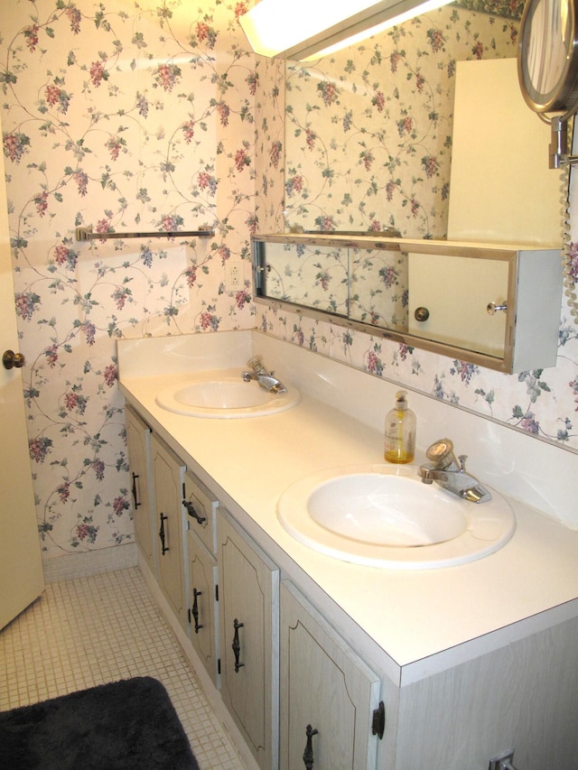 bathroom with tile patterned flooring and vanity