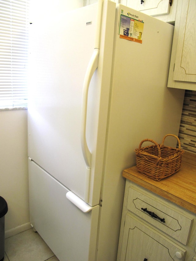 room details with white refrigerator and butcher block counters