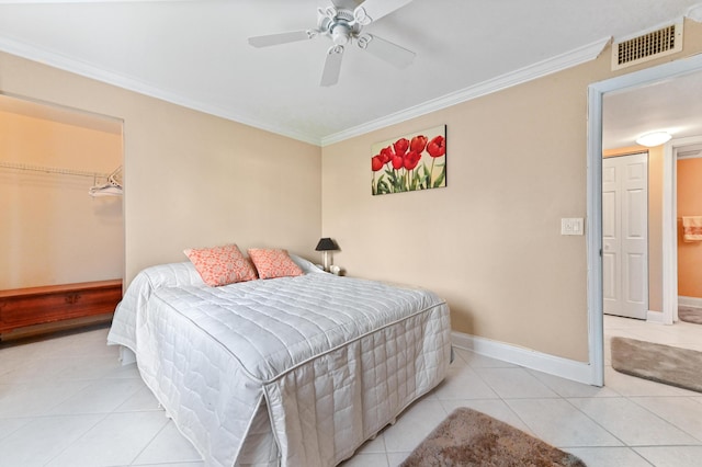 bedroom featuring baseboards, tile patterned floors, visible vents, and crown molding