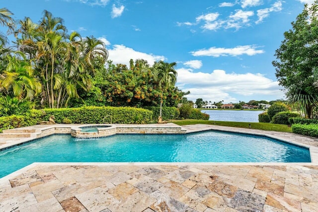 view of swimming pool featuring an in ground hot tub and a water view