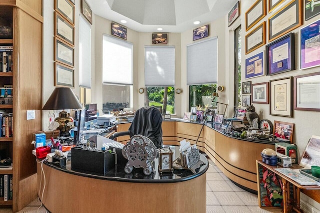 tiled home office with a tray ceiling