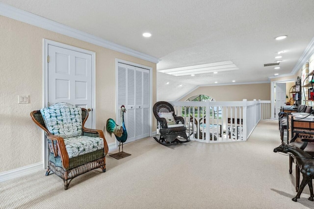 living area with vaulted ceiling, a textured ceiling, and crown molding