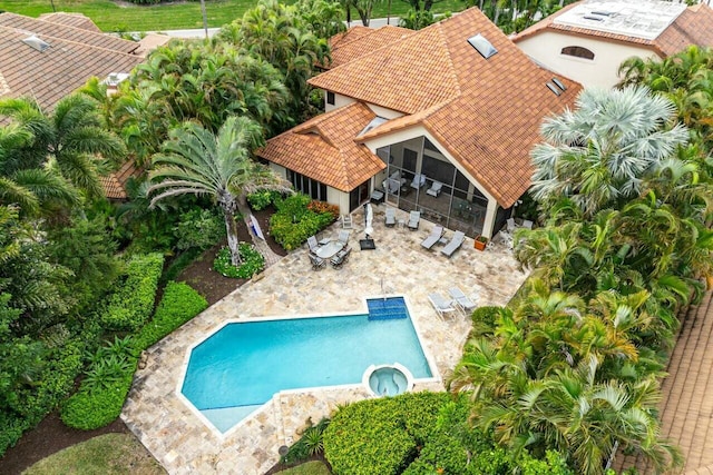 exterior space with a patio area and a sunroom