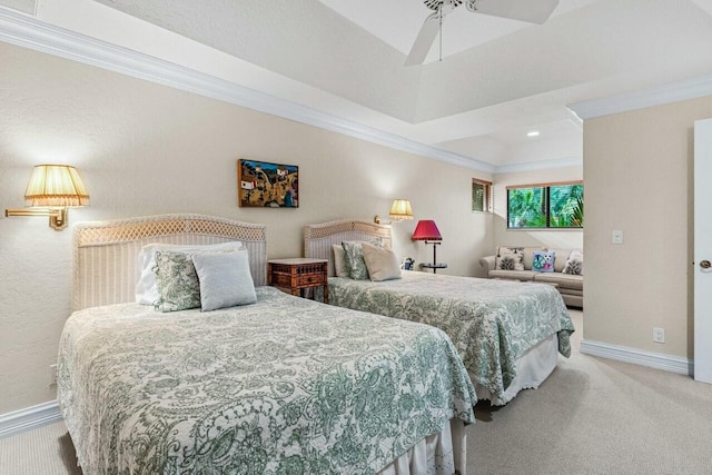 bedroom with ornamental molding, light colored carpet, and ceiling fan