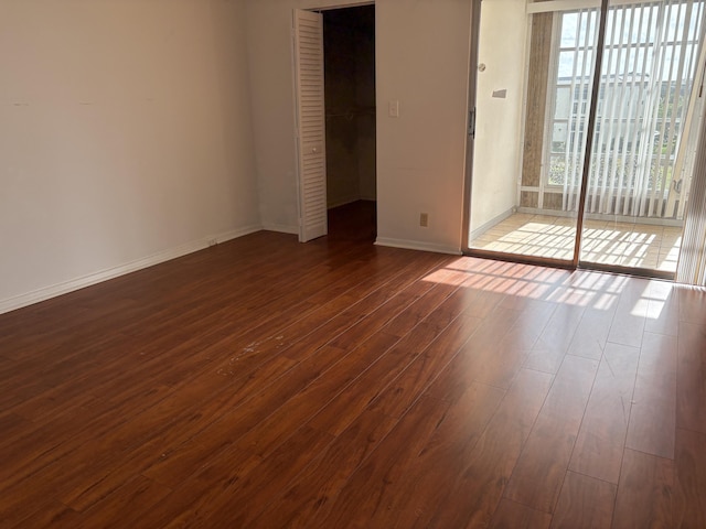 empty room featuring dark hardwood / wood-style floors