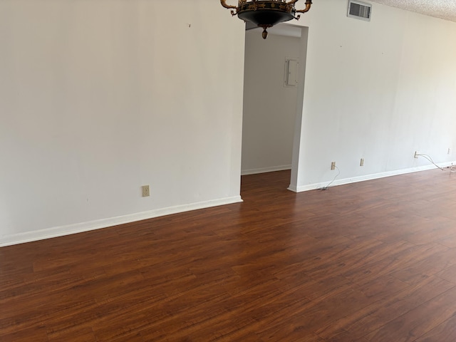 empty room featuring dark hardwood / wood-style floors