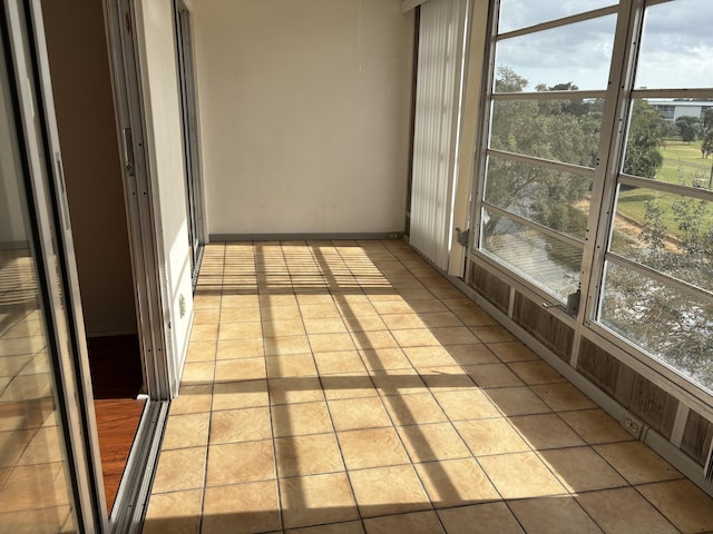 unfurnished sunroom with a wealth of natural light