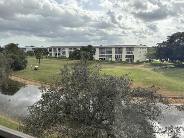 exterior space with a yard and a water view