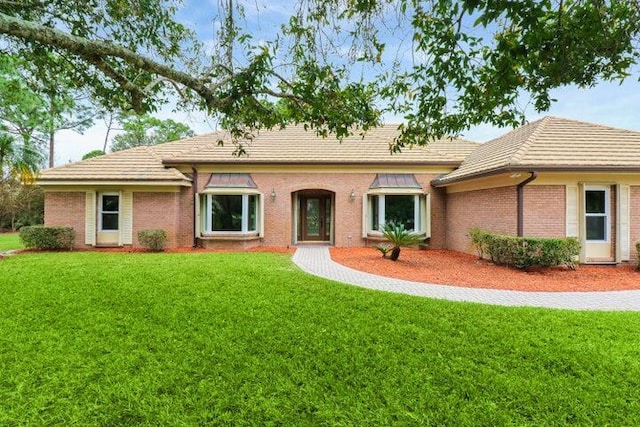 ranch-style house with a front yard