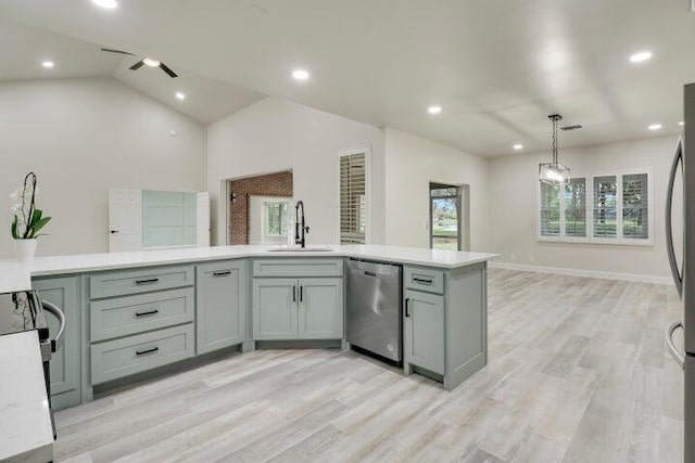 kitchen with sink, stainless steel dishwasher, lofted ceiling, and light hardwood / wood-style flooring