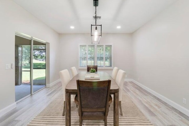 dining space with plenty of natural light and light wood-type flooring