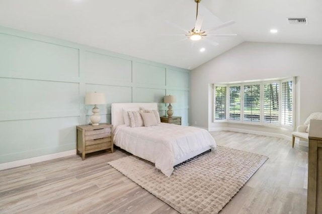 bedroom featuring vaulted ceiling, light hardwood / wood-style flooring, and ceiling fan