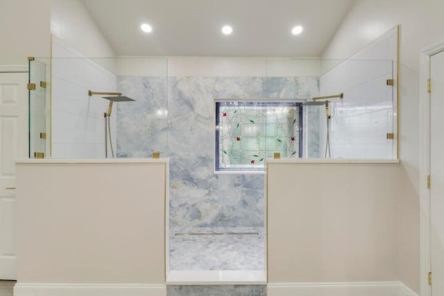 bathroom featuring tiled shower