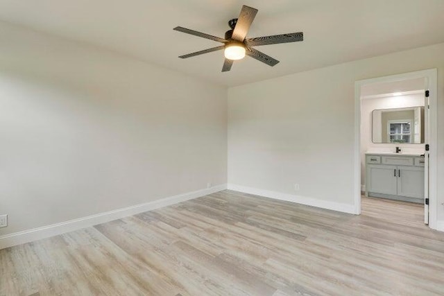 empty room featuring light wood-type flooring and ceiling fan