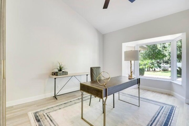 office space featuring light wood-type flooring, ceiling fan, and lofted ceiling