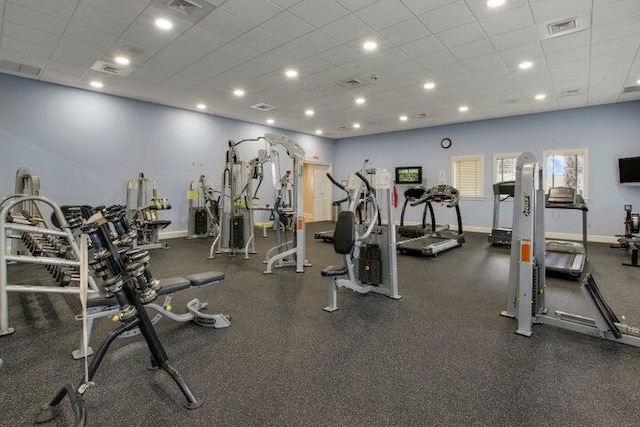 exercise room with a drop ceiling