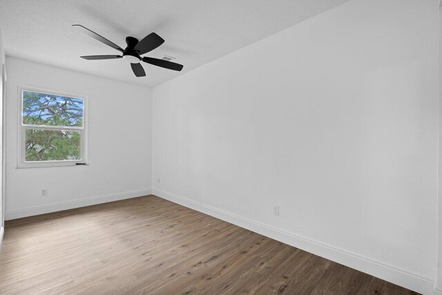 unfurnished bedroom with a closet, hardwood / wood-style flooring, and ceiling fan