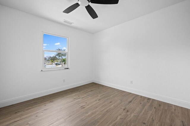 unfurnished bedroom with wood-type flooring, a closet, and ceiling fan