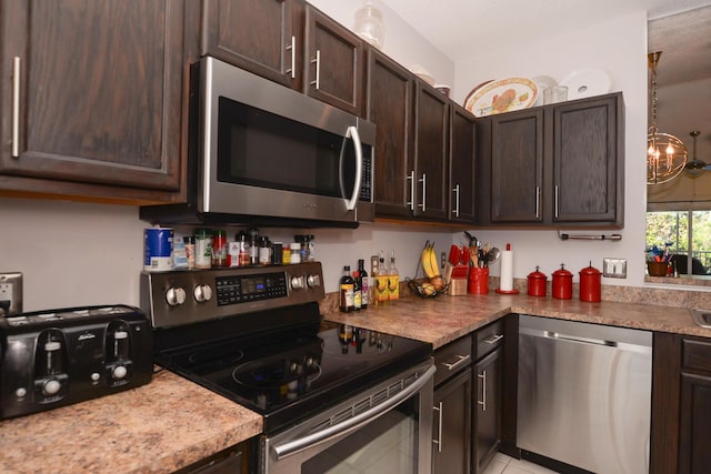 kitchen featuring stainless steel appliances and dark brown cabinets