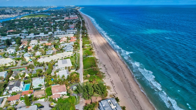 bird's eye view with a view of the beach and a water view