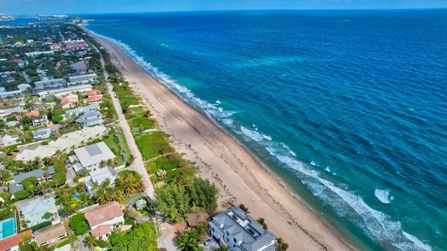 aerial view featuring a water view and a beach view