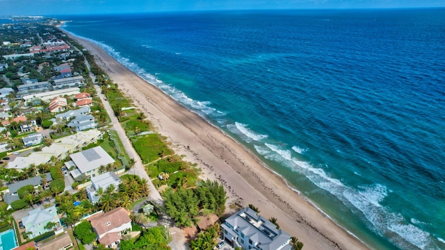 bird's eye view with a beach view and a water view