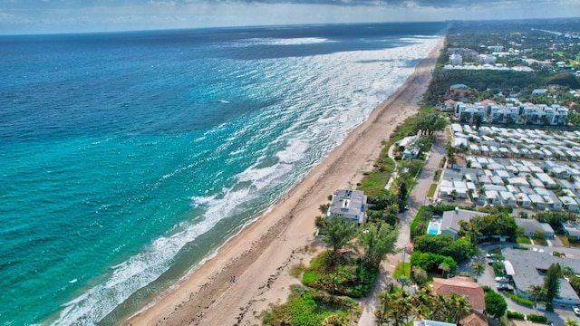 bird's eye view with a view of the beach and a water view