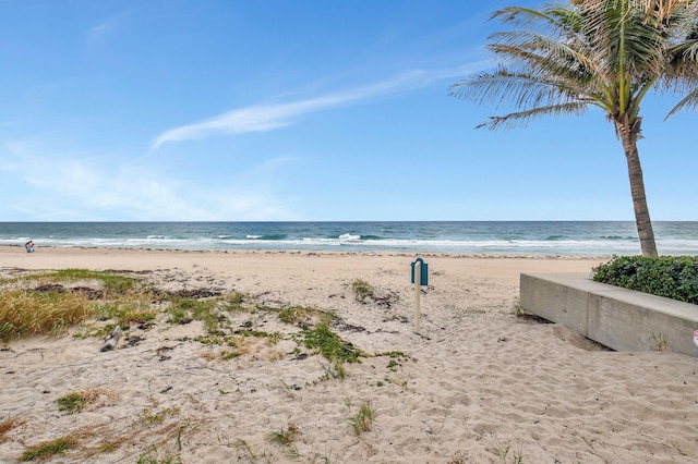 view of water feature with a beach view