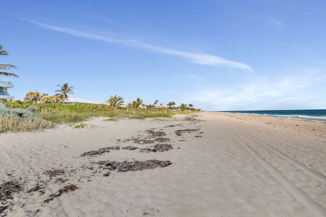 property view of water featuring a beach view