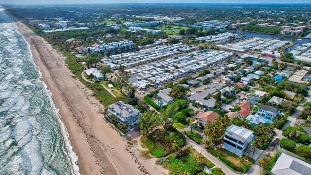 drone / aerial view with a view of the beach and a water view