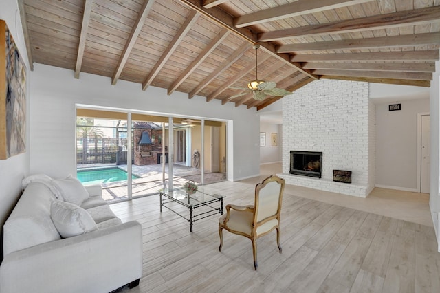 living room with ceiling fan, beam ceiling, light wood-type flooring, and wood ceiling