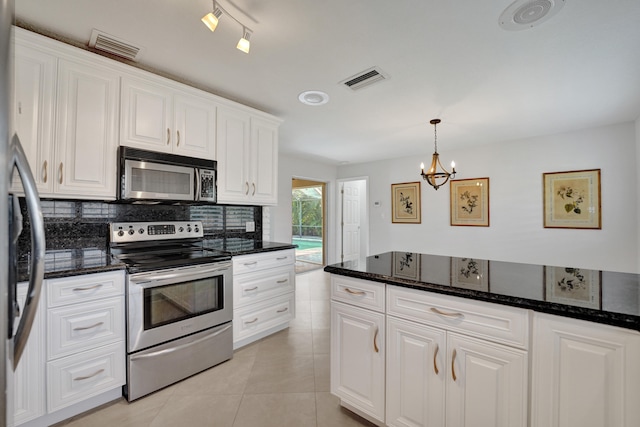 kitchen with stainless steel appliances, pendant lighting, light tile patterned floors, an inviting chandelier, and white cabinetry