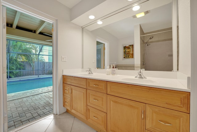 bathroom with tile patterned floors and vanity