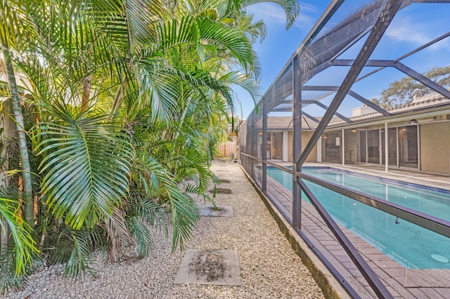 view of pool with a lanai