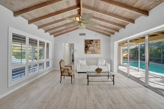 living room featuring beamed ceiling, wood ceiling, and light hardwood / wood-style flooring