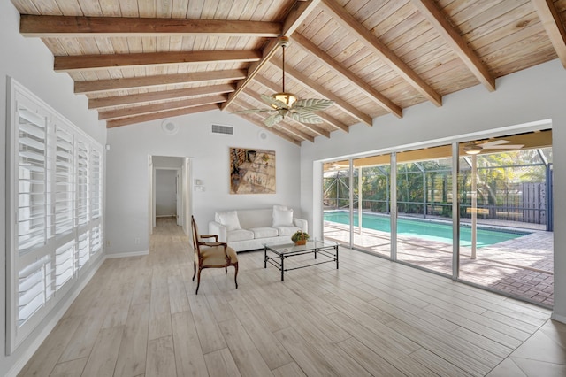 unfurnished living room with ceiling fan, light hardwood / wood-style flooring, beamed ceiling, and wood ceiling